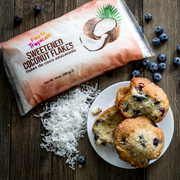 Bag of sweetened coconut flakes with blueberry muffins